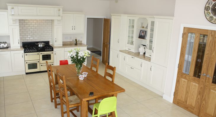 brown kitchen design with dining table